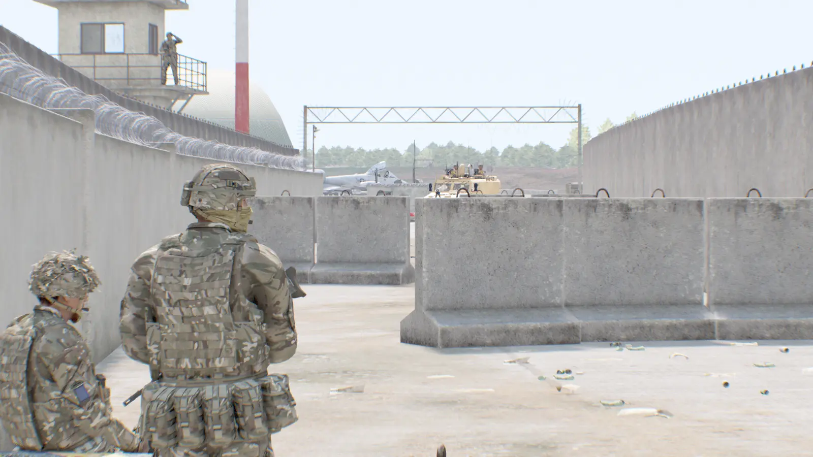Soldiers on overwatch at a sandbagged checkpoint