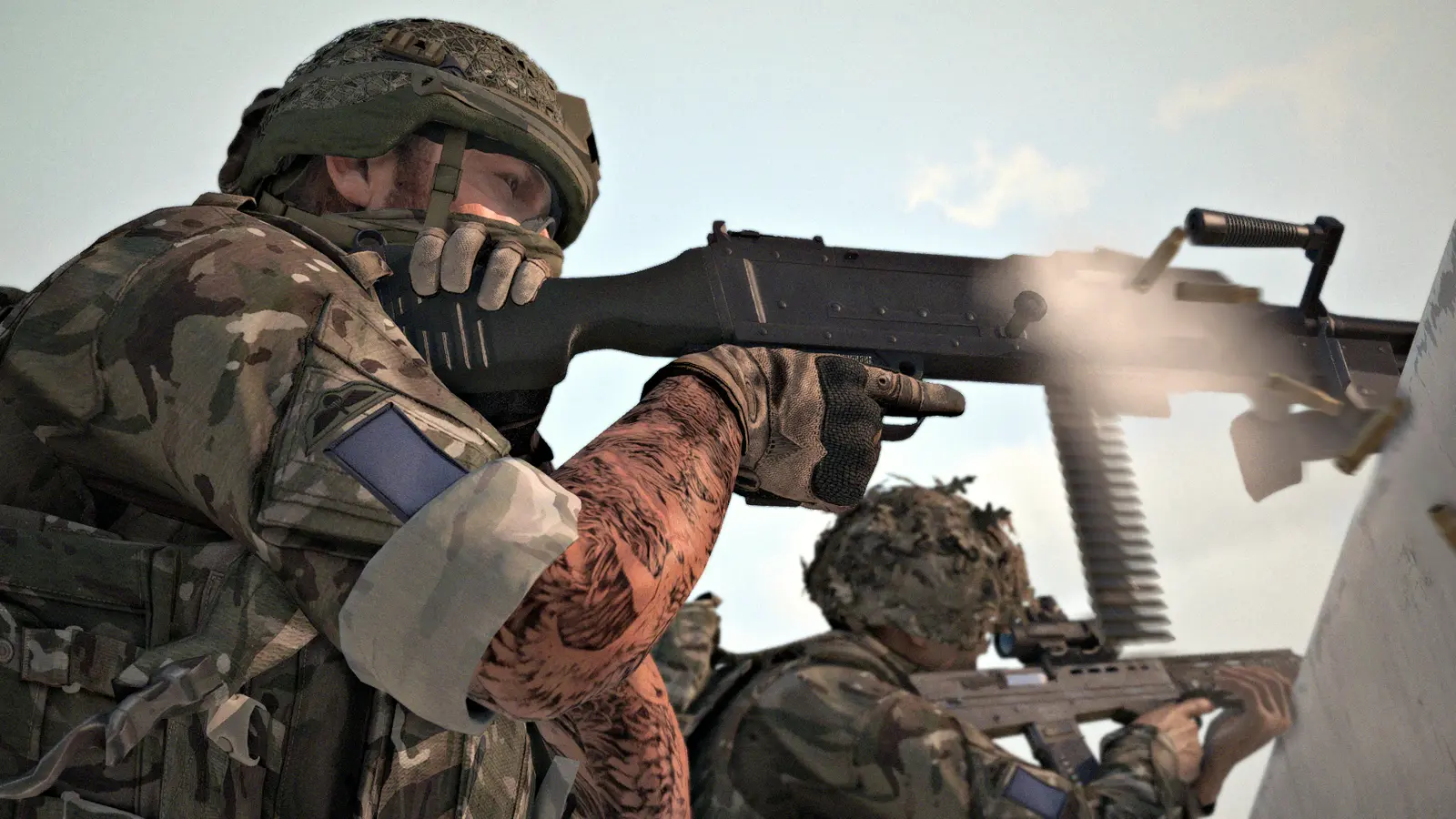 GPMG gunner firing with visible muzzle flash