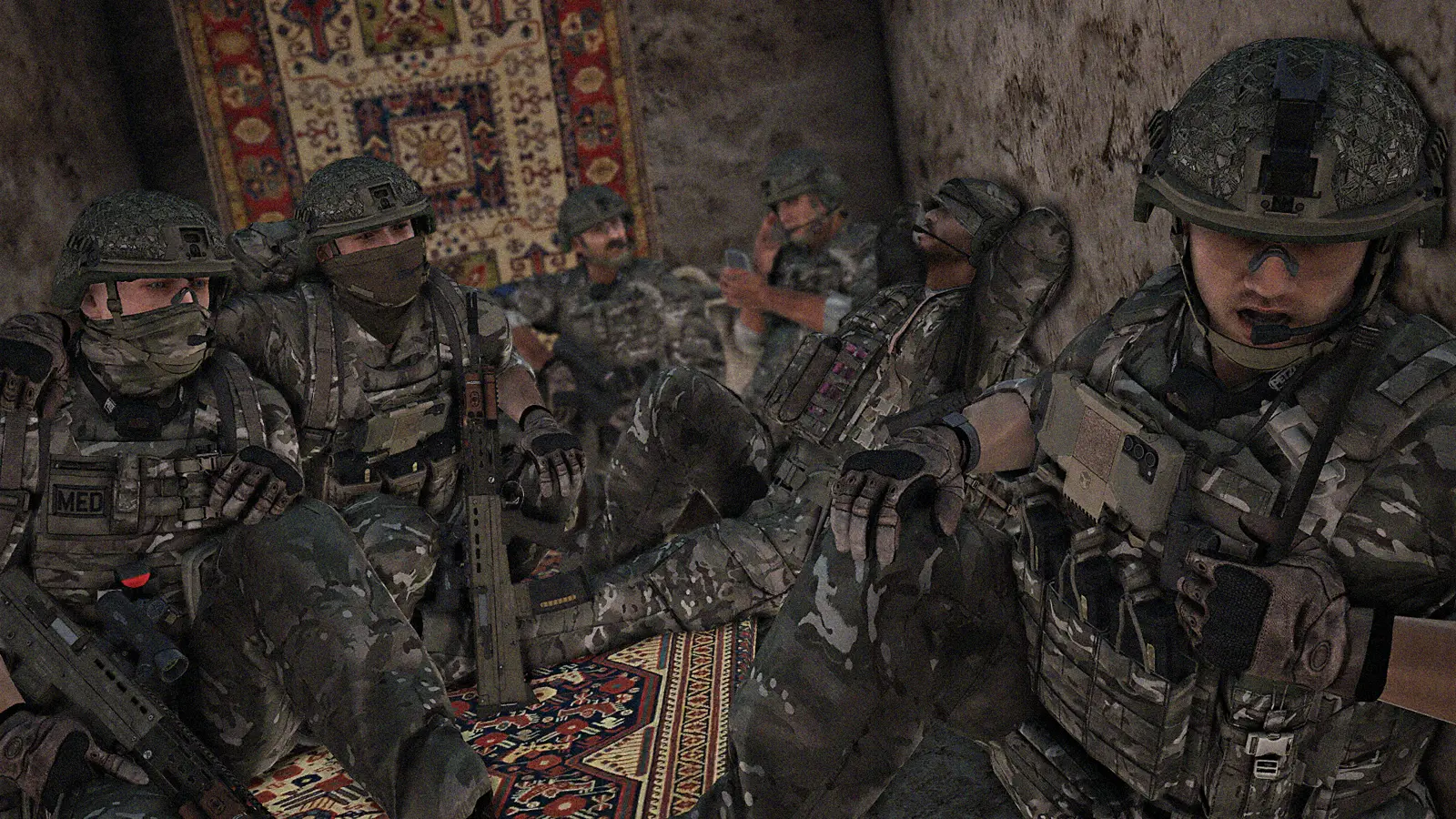 Section medic and riflemen resting inside a compound