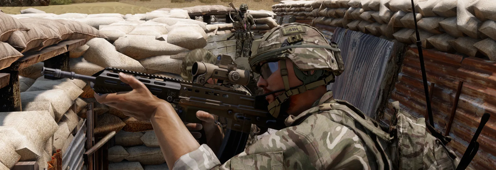 A rifleman covering an approach from a sandbagged trench line.