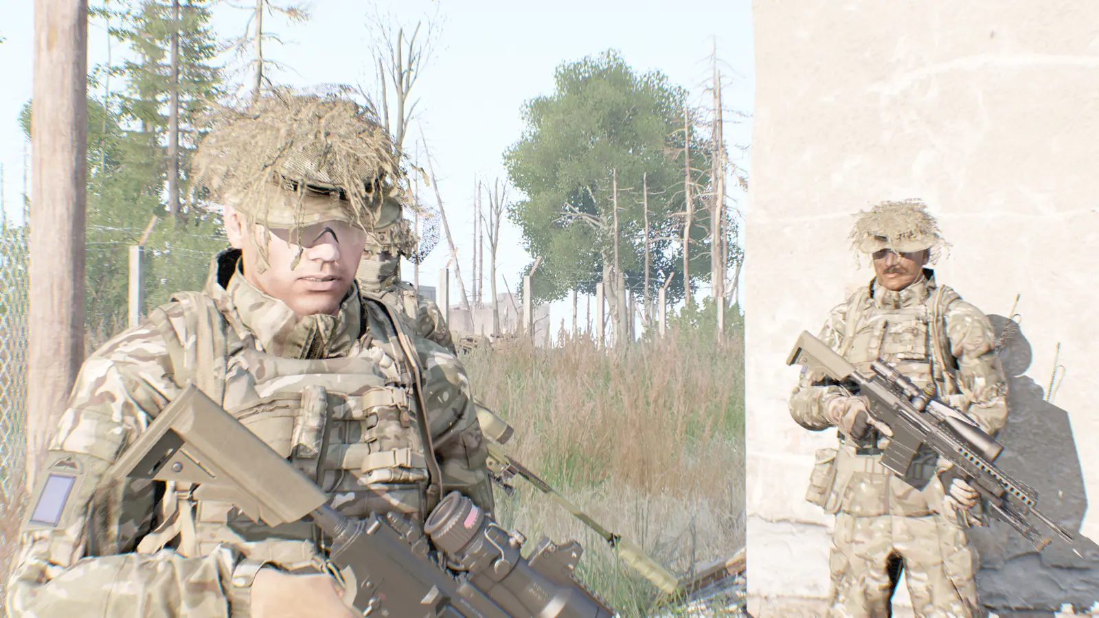 Second pair of riflemen holding overwatch in tall grass near ruins