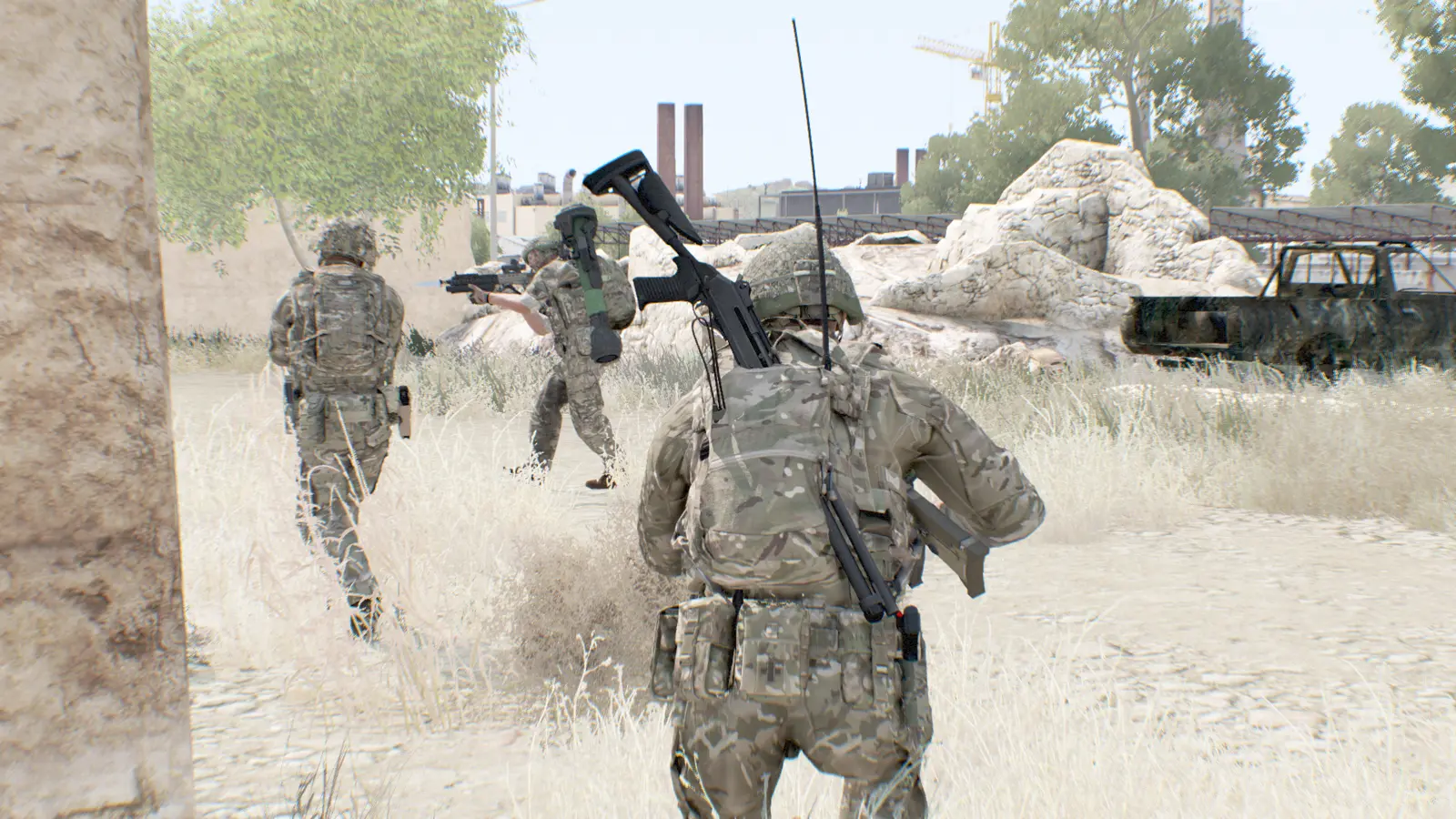 Two soldiers moving through urban rubble