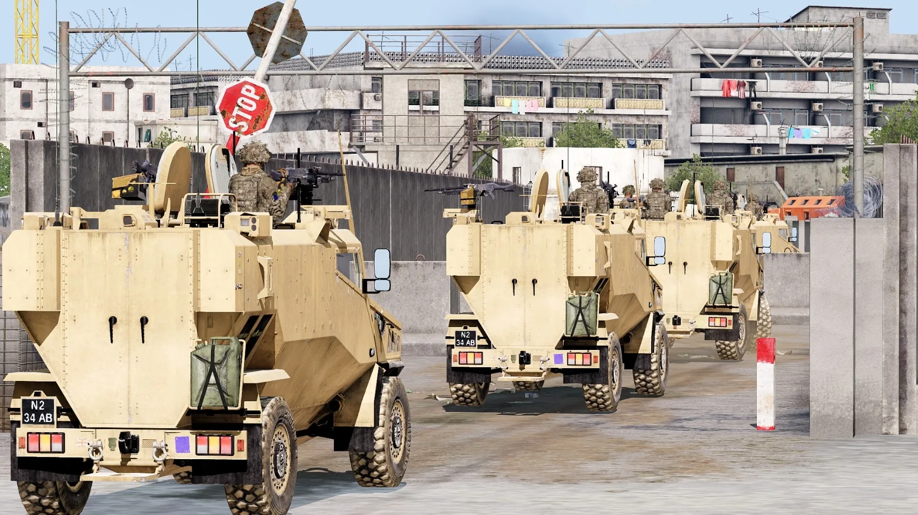 Foxhound protected vehicles leaving base on patrol.