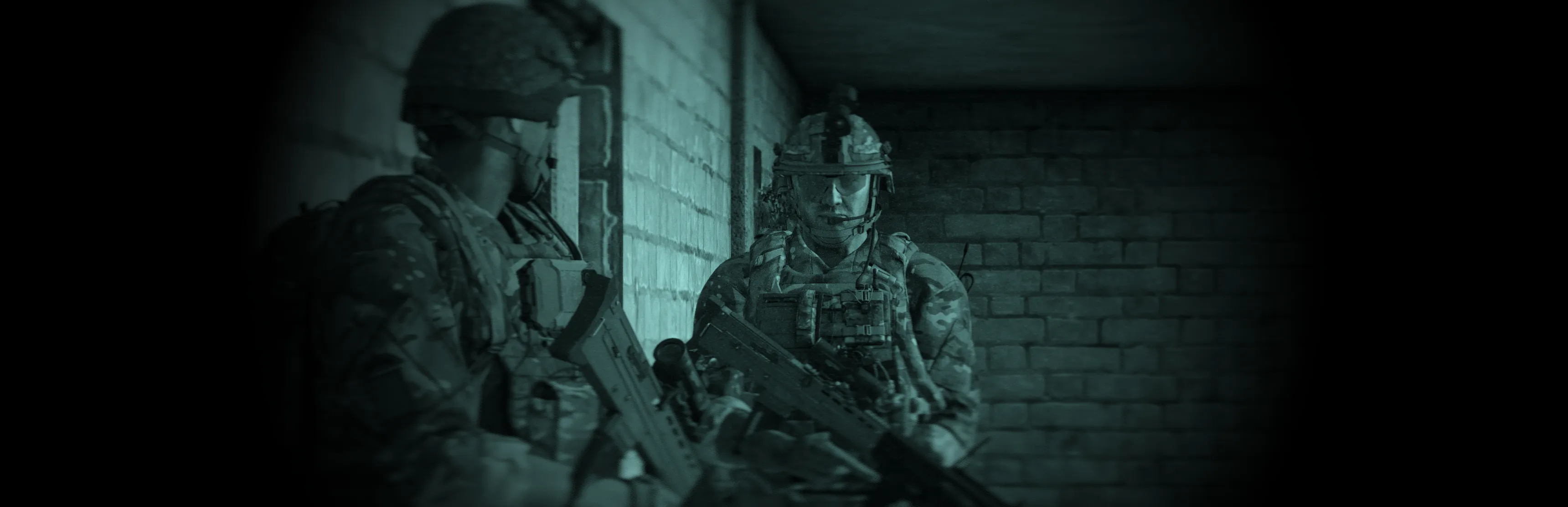 A section briefing before a night operation, NVGs mounted.